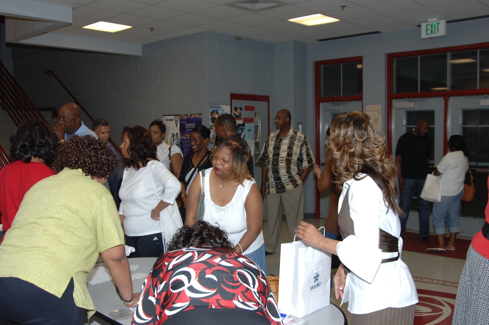 Alumni at school hallway event